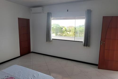 Postel nebo postele na pokoji v ubytování Casa de temporada Guriri com Piscina - Cod 34