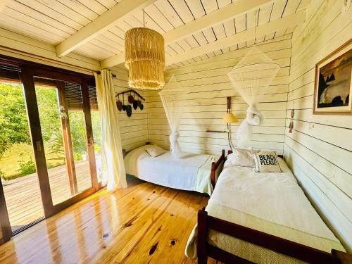 a bedroom with two beds in a room at Bilú in La Pedrera