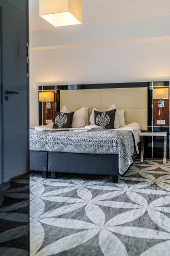 Ένα ή περισσότερα κρεβάτια σε δωμάτιο στο ApartHotel Tatry de Luxe FizjoMedical & Spa