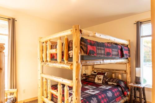 a bedroom with two bunk beds in a house at Keweenaw Waters Resort in Houghton