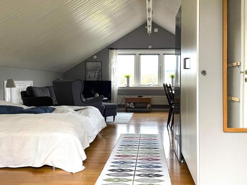a bedroom with two beds and a living room at 4 star holiday home in Romelanda in Romelanda