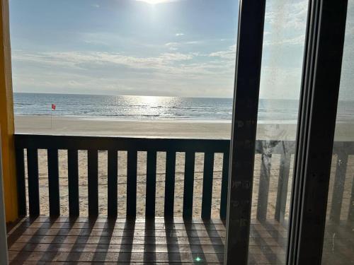 a view of the beach from a balcony at Eco Wooden Homes in Benaulim