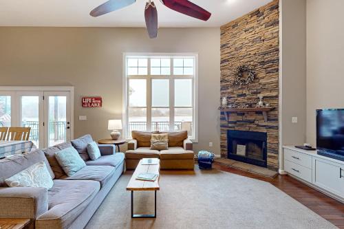 a living room with a couch and a fireplace at Tranquil Point in Mineral