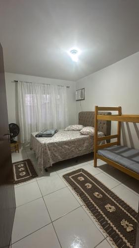 Ένα ή περισσότερα κρεβάτια σε δωμάτιο στο Cantinho da jana