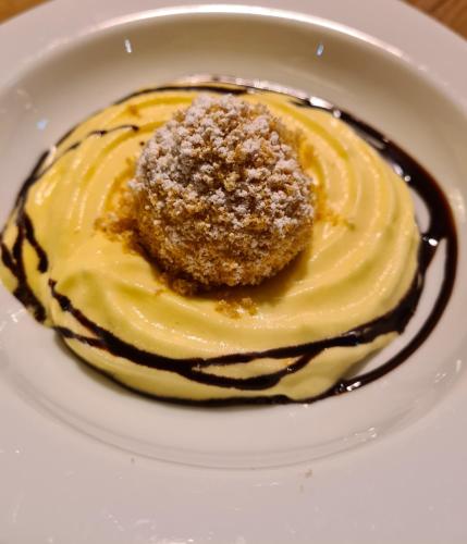 a dessert on a white plate on a table at Hotel Koch in Obertauern