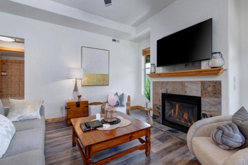 a living room with a couch and a fireplace at Fox Pointe Condo by Park City Vacations in Park City