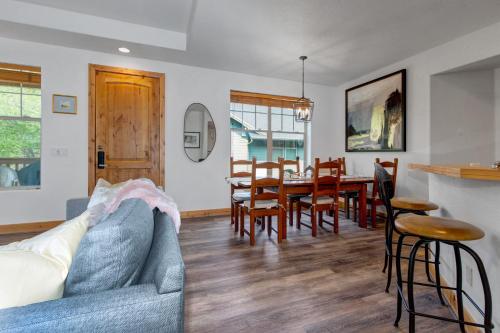 a living room with a couch and a table and chairs at Fox Pointe Condo by Park City Vacations in Park City