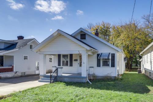a white house with a porch in a yard at Close to University and Dtwn Home in Dayton in Dayton