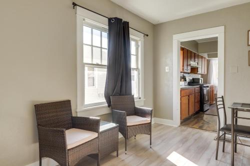 a living room with chairs and a table and a kitchen at Close to University and Dtwn Home in Dayton in Dayton
