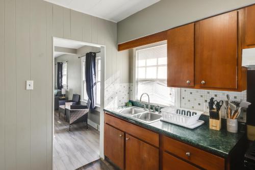 a kitchen with a sink and a counter top at Close to University and Dtwn Home in Dayton in Dayton