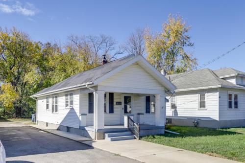 a small white house with a porch at Close to University and Dtwn Home in Dayton in Dayton