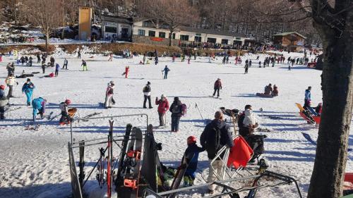 a group of people standing in the snow at Hotel Veles in Querciola
