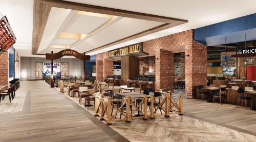a dining area with tables and chairs in a restaurant at Hard Rock Hotel & Casino Bristol in Bristol