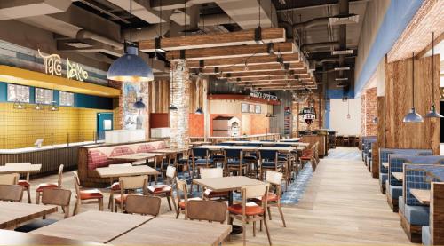 a restaurant with tables and chairs and a bar at Hard Rock Hotel & Casino Bristol in Bristol