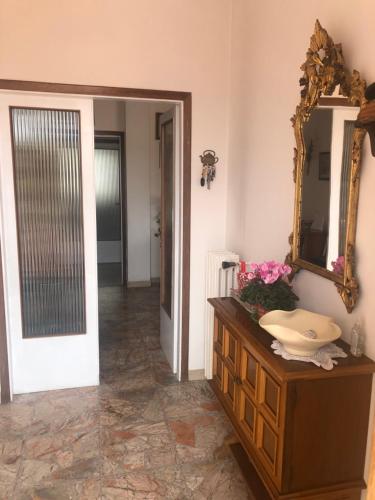 a bathroom with a sink and a mirror at Dolce casa con terazza in San Piero a Sieve