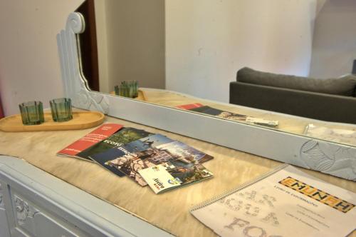 a table with a mirror on top of it at Emunah - no coração de Aveiro in Aveiro