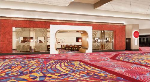 a large lobby with a colorful rug on the floor at Hard Rock Hotel & Casino Bristol in Bristol
