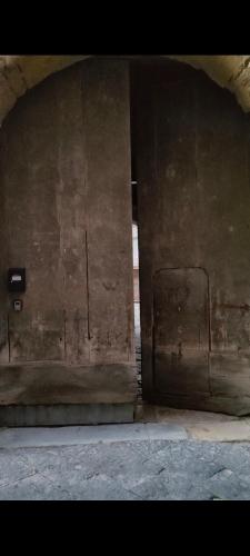 a building with a wall with a door in it at Centro Storico - La Dimora del Pellegrino in Capua