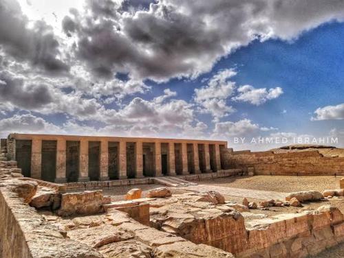 a view of a building with a cloudy sky at Grand Square Hostel Luxor in Luxor