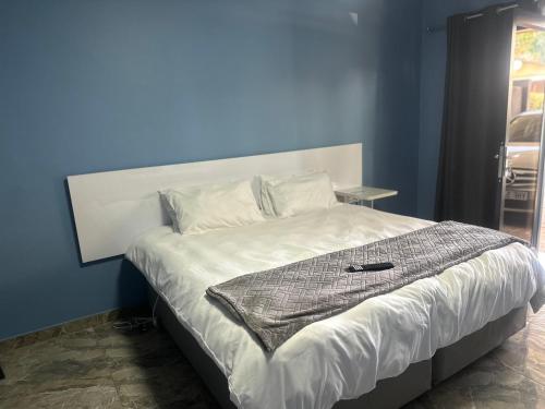 Postel nebo postele na pokoji v ubytování GuestHouseTwentyFour