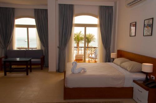 Säng eller sängar i ett rum på Elaria Hotel Hurgada