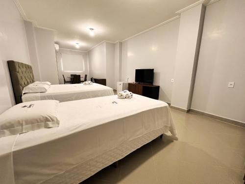 Postel nebo postele na pokoji v ubytování Danny's Hotel