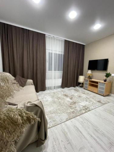Televisor o centre d'entreteniment de Дом 2 Комарова