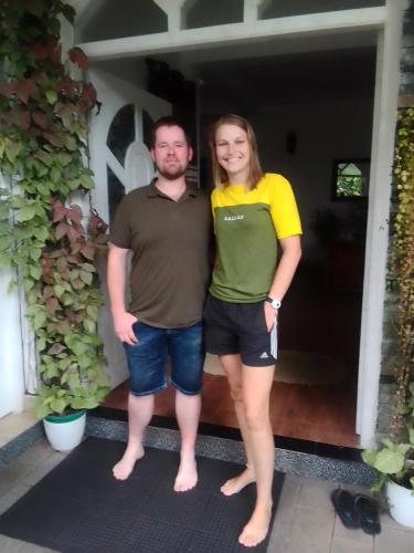 a man and a woman standing in front of a house at Kandy Home stay in Katugastota
