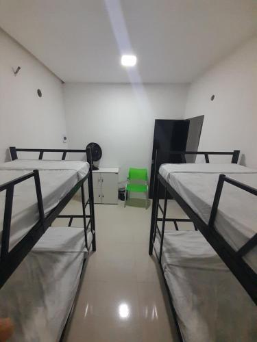 Katil atau katil-katil dalam bilik di Hostel e Pousada Garanhuns