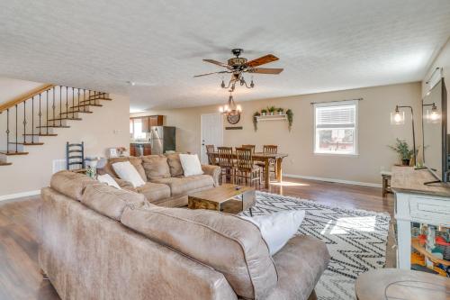 a living room with a couch and a ceiling fan at Pet-Friendly Shenandoah Cabin with Fire Pit and Grill! in Shenandoah