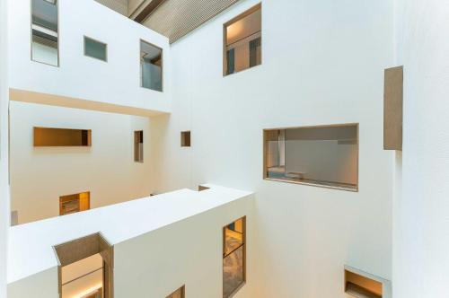 a group of windows in a white building at Holiday Inn Express Datong Pingcheng by IHG in Datong