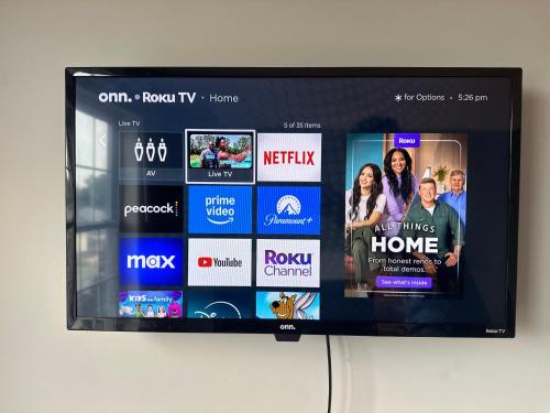 a television screen on a wall with several different websites at Dupont4 Oasis in Minneapolis