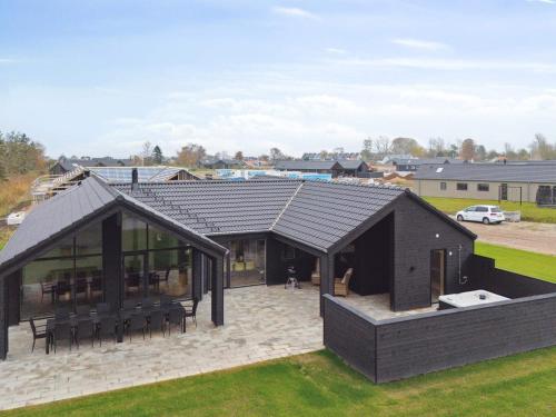 an image of a house with a roof at Luxury Retreat by Hasmark - By Traum Ferienwohnungen in Otterup