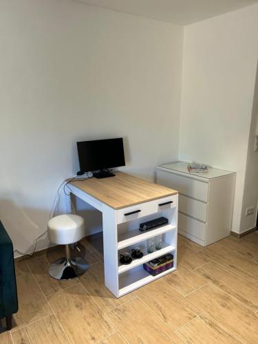 a white desk with a computer on top of it at Am Wehr Rheine in Rheine
