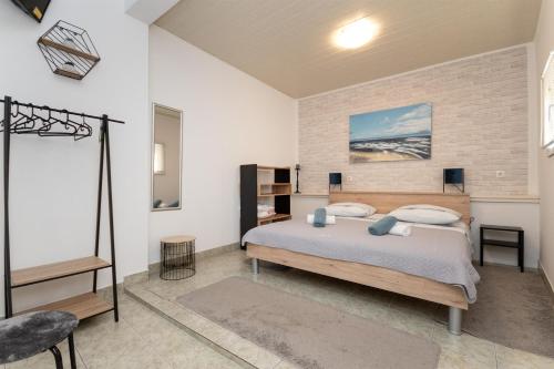 Postel nebo postele na pokoji v ubytování Apartments Ivan