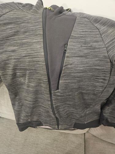 a close up of a shirt on a couch at L'appart'hôtel 23ème avenue - Spa privatif - Love room - Appartements à thèmes in Lamalou-les-Bains