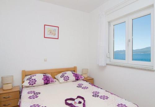 Postel nebo postele na pokoji v ubytování Apartments Ljuba