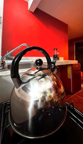 a tea pot sitting on top of a stove at Montecarlo in Toluca