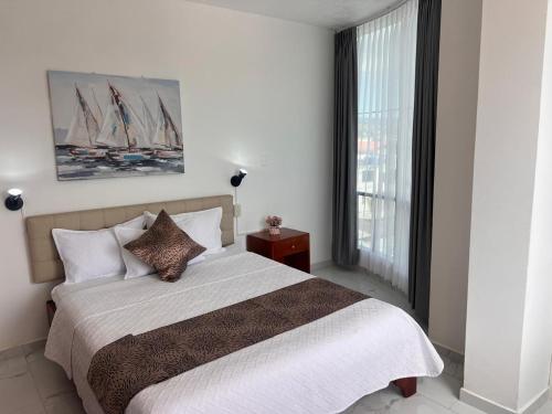 Postel nebo postele na pokoji v ubytování Hostal Carliza