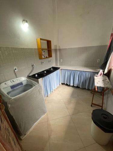 a bathroom with a sink and a toilet in a room at Residencial Lima in Trancoso