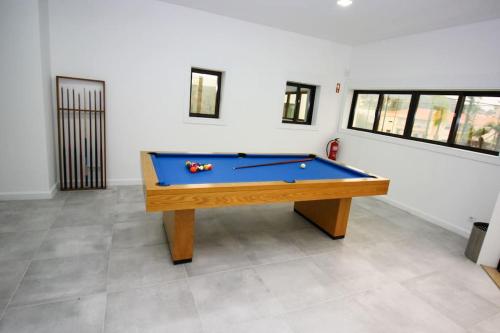 a billiard table in a room with at Requinte House in Nogueira de Cravo
