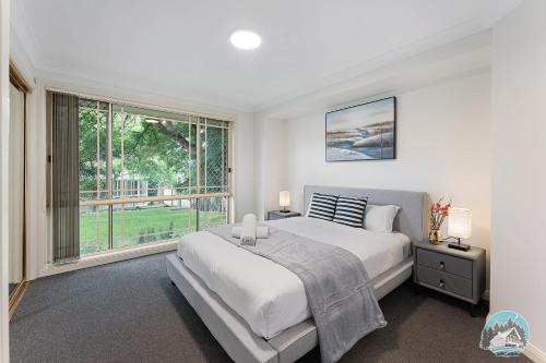 Кровать или кровати в номере Spacious 4-Bedroom House in Peaceful Epping