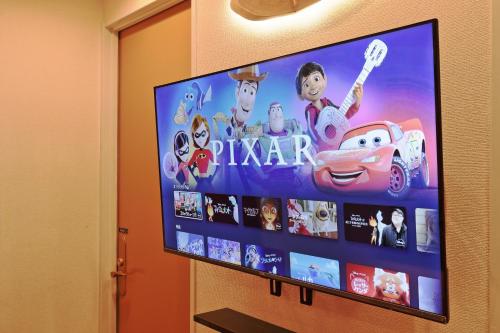 a flat screen tv hanging on a wall at V.Close to Shinjuku Kabukicho/Korean Town/FrWIFI D in Tokyo