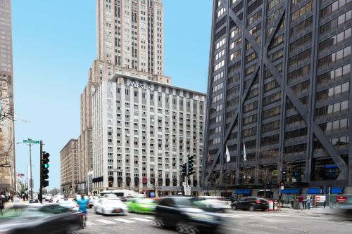 a busy city street with tall buildings and cars at The Westin Michigan Avenue Chicago in Chicago