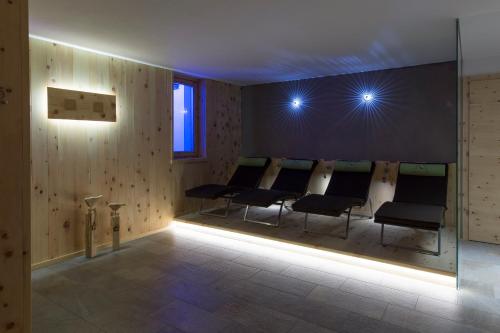 a row of chairs in a waiting room at Mountainlodge Luxalpine in San Vigilio Di Marebbe