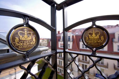 two iron gates with a view of a city at Baltic Home in Świnoujście