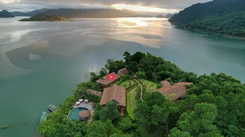 an aerial view of an island in the middle of a river at Mai Chau Hideaway Lake Resort in Mai Chau