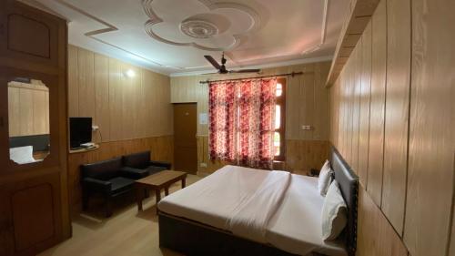 TV a/nebo společenská místnost v ubytování Hotel Ekant Lodge