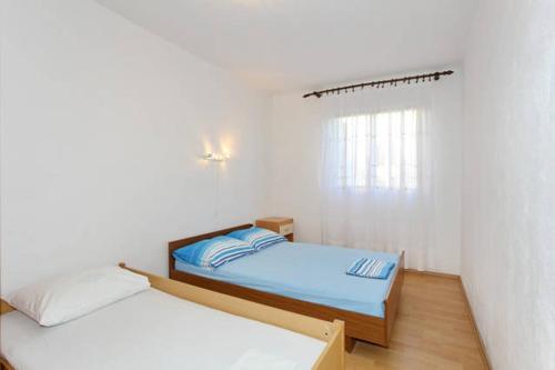 Posteľ alebo postele v izbe v ubytovaní Apartment Elena