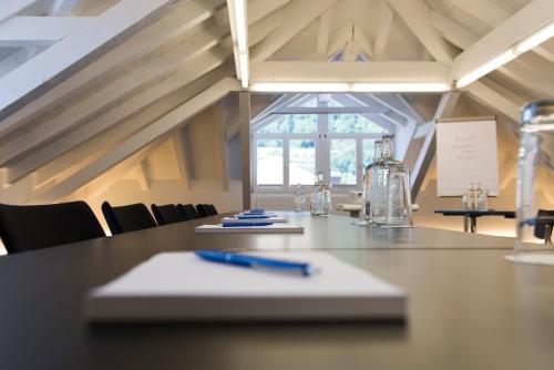 a long table with a pen on top of it at Hotel Weiss Kreuz in Thusis